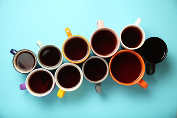 Black tea (coffee) in bright cups, office break, team building.