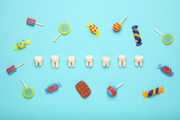 Teeth with sweet candies. Tooth caries in children's, dental healthcare.