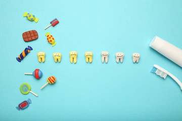 Teeth with sweet candies. Tooth caries in children's, dental healthcare, toothpaste and toothbrush.