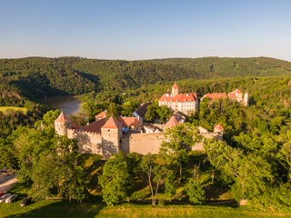 Fototapeta na wymiar Aerial photo of Veveri castle near Brno city. South Moravia region, surrounded by river Svratka. Summer day with blue sky, sunset and soft light.