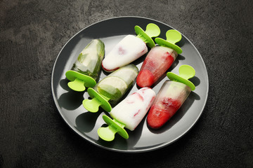Sweet homemade dessert, popsicles (sorbet) for summer coolness. Frozen juice and ice cream.