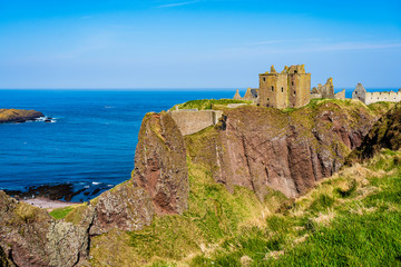 Dunnottar Castle with blue sky in - Stonehaven, Aberdeen, Scotland UK
