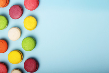 Bright background with a rows of macaroons and copy space