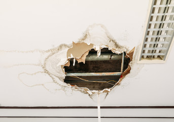 gypsum ceiling decay hole interior office building