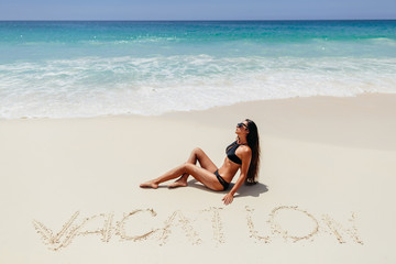 Fototapeta na wymiar woman on beach vacation in tropics