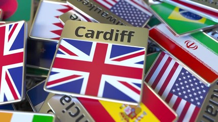 Souvenir magnet or badge with Cardiff text and national flag among different ones. Traveling to the United Kingdom conceptual intro animation