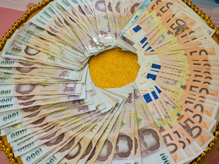 Top view of thai and european bank notes