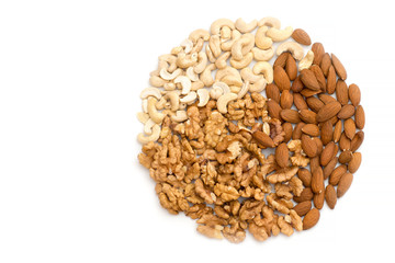 Walnuts, almonds and cashews on a completely white background. Circle of different nuts