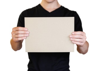 A man holding a piece of cardboard in his hands. Holding a booklet. Close up. Isolated on white background