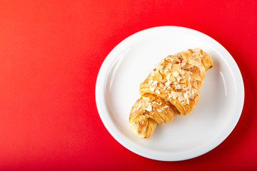 freshly baked croissants on a plate.