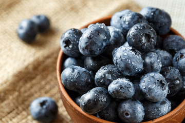 Fresh Blueberries in  Bowl. Healthy diet vegetarian food. Top view.