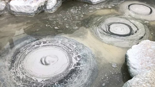 Hot boiling grey bubbles mud pond, lava Volcano Dome Bubbling hot pool (Mud Hell) locating Beppu, Oita-shi, Kyushu, Japan