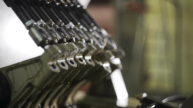 Close-up loom mechanisms. Production line of polypropylene bags for food and non-food bulk goods. PP bag