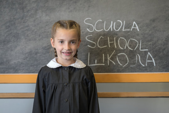 Elementary school student posing in language school classroom - Powered by Adobe