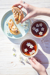still life - cups of tea and bun