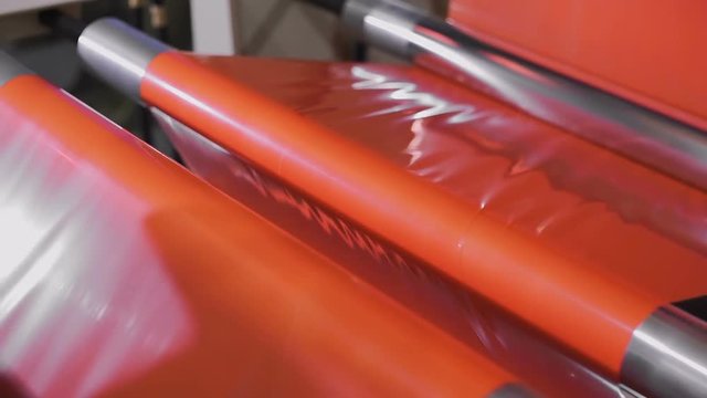 The polypropylene extruder with a flat slit nozzle is heated to 260 C. Fabrication and winding of flat thread. Thin film after cooling is cut into flat threads of the required thickness