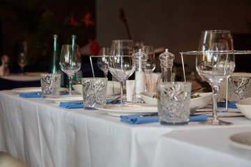 Table in the restaurant, served with wine glasses and ready to welcome guests