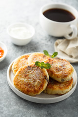 Homemade cottage cheese pancakes on white plate
