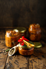 Homemade roasted vegetables sauce in jars