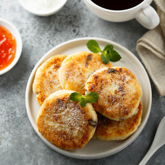 Homemade cottage cheese pancakes on white plate