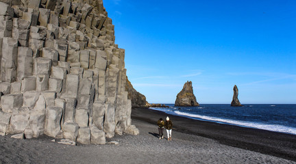 Columns of Basalt on the black sand beach of Reynisfjara in Iceland