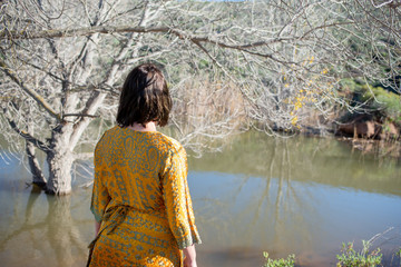 Woman standing and viewing lake