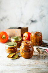 Homemade roasted vegetables sauce in jars