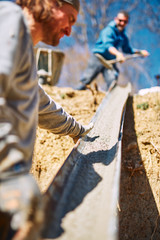 Construction worker on a heavy site doing hard work.