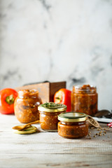 Homemade roasted vegetables sauce in jars