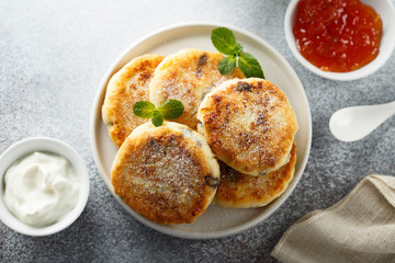 Homemade cottage cheese pancakes on white plate