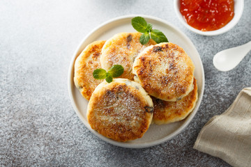 Homemade cottage cheese pancakes on white plate