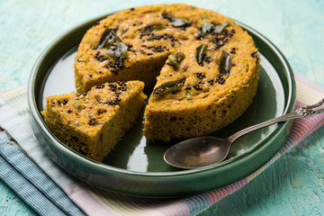 Handvo/handwa is a vegetable cake originating from the Gujarat, India. selective focus