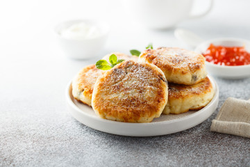 Homemade cottage cheese pancakes on white plate