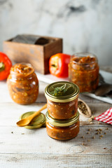 Homemade roasted vegetables sauce in jars