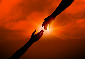 Woman reaching for man's hand at sunset, closeup. Help concept