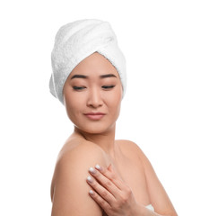 Portrait of beautiful Asian woman with towel on head against white background. Spa treatment