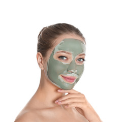 Beautiful woman with clay mask on her face against white background