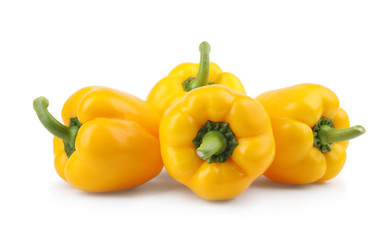 Ripe yellow bell peppers isolated on white