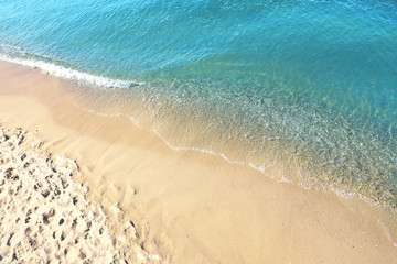 Sandy beach near sea on sunny day