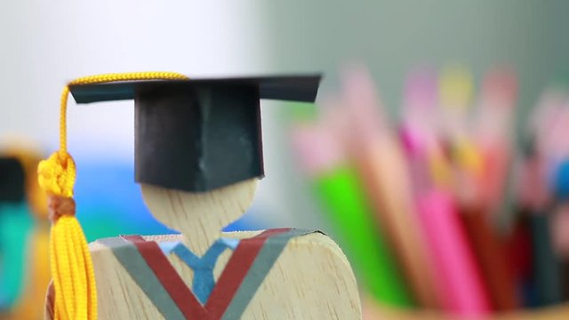 Education knowledge learning study abroad international Ideas. People Sign wood Graduation celebrating cap on textbook in library,Alternative studying distant for learn.Back to School in successful