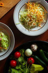 Several salads with vegetables and greens. Healthy food concept. Mixed vegetables