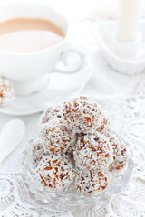 Dried fruit candies in coconut balls in the form of balls, selective focus