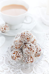 Dried fruit candies in coconut balls in the form of balls, selective focus