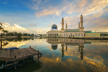 Colorful sunrise sky at Kota Kinabalu City Mosque, one of the main landmarks and attractions in...
