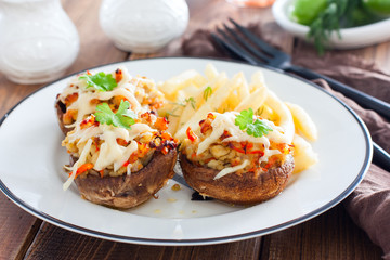 Stuffed champignons with cheese on a white plate, horizontal