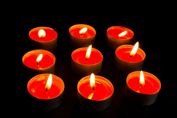 burning Candles on black background