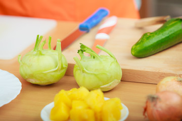 preparing vegetables salad kohlrabi on cutting board