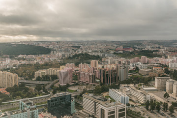 Portuguese capital Lisbon from above. City skyline with clouds in the sky and stadium in the...
