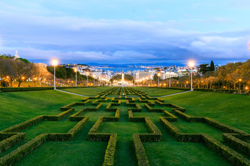 Park Eduardo as a viewpoint in Lisbon. View of the valley of the capital of Portugal. On the horizon, the river name Tejo can be seen. Buildings in the foreground and clouds in the sky