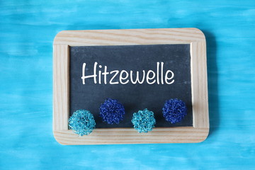 Hitzewelle / Schiefertafel mit Schrift